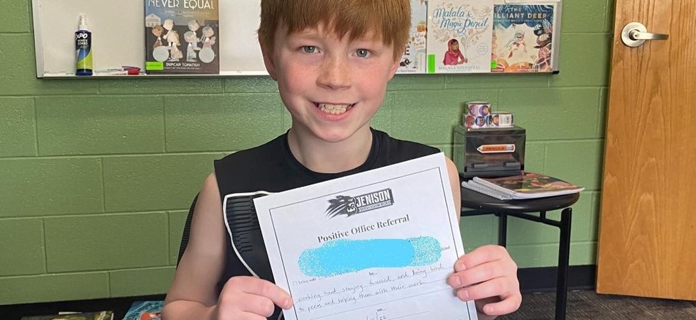 Student smiling with certificate