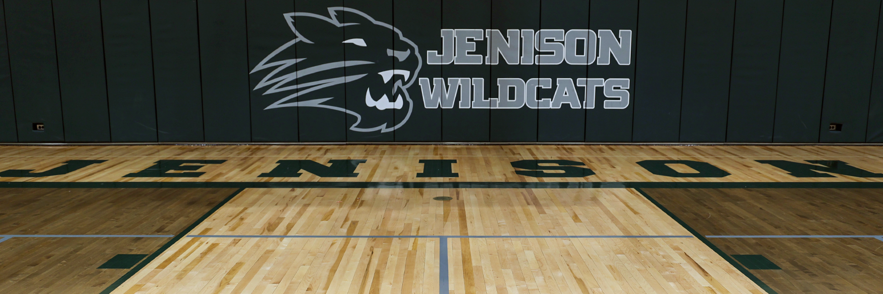Gym with Wildcats and Jenison Logos