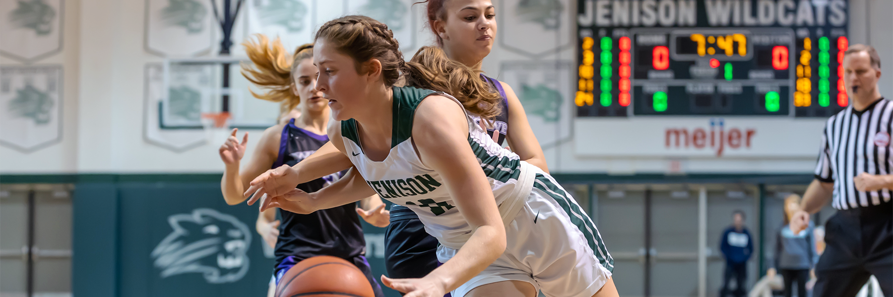 Female basketball player dribbling