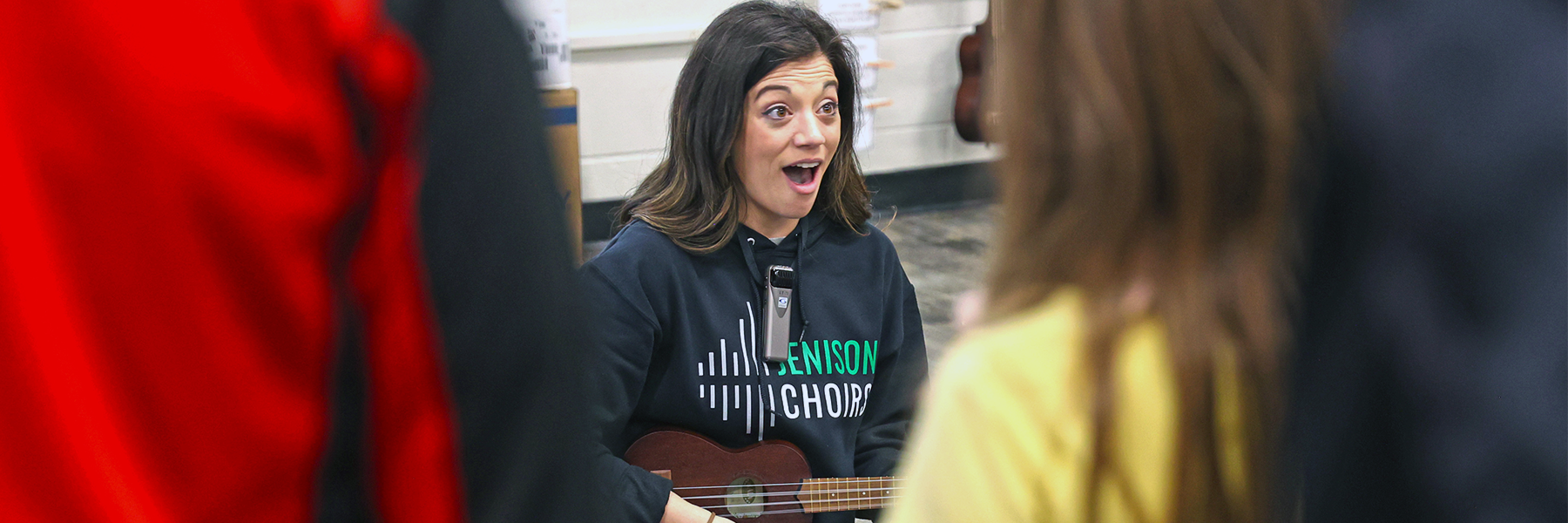 Music class teacher playing instrument