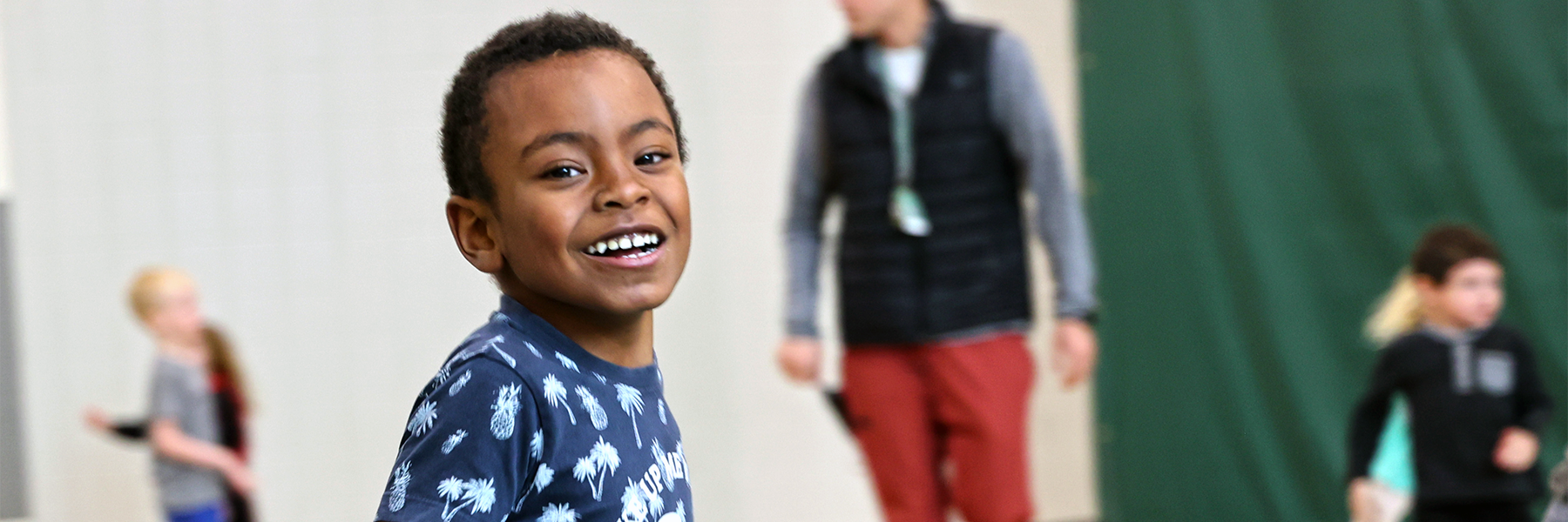 Student smiling in gym class