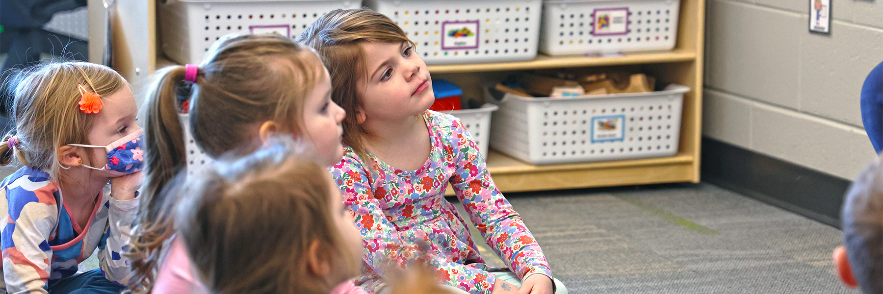 Kids sitting listening in class